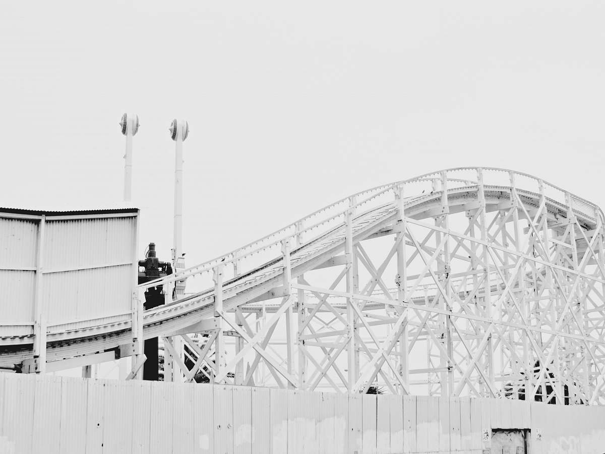 amusement park white metal bridge roller coaster